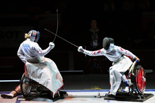 Hungary's Zsuzsanna Krajnyak (L) compets against China's Wu Bai Li during the final of the Wheelchair Women's Epee at the 2011 World Fencing Championships. China's wheelchair fencers will be aiming to better their four-medal tally from 2008 with a team that includes three World Champions, and the country also boasts powerful swimming and archery teams