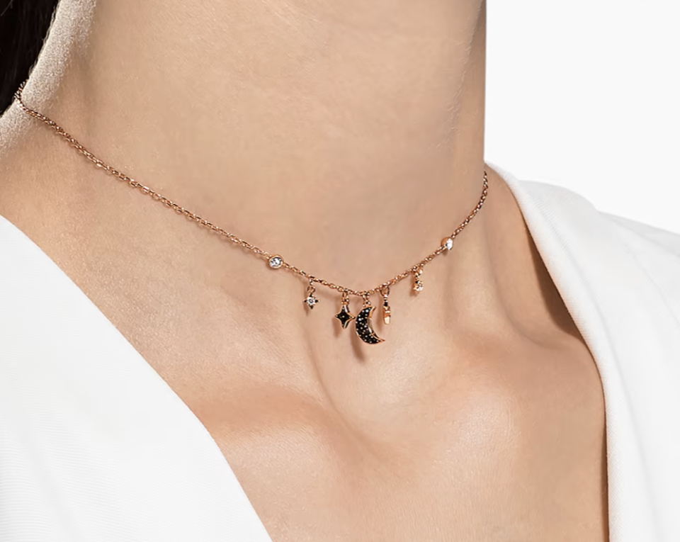 Swarovski Symbolic necklace, Moon and star, Black, Rose gold-tone plated. PHOTO: Swarovski