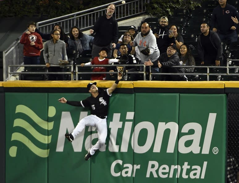 Chicago White Sox center fielder Adam Engel misses the ball and loses his glove on Shohei Ohtani’s three-run home run. (AP)