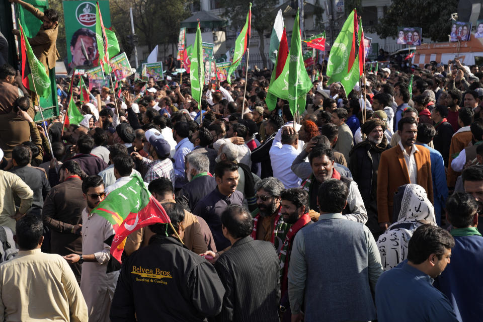 Supporters of Pakistan's former prime minister Imran Khan's 'Pakistan Tehreek-e-Insaf' party participate in a rally, in Lahore, Pakistan, Wednesday, Feb. 22, 2023. Hundreds of supporters of Pakistan's former prime minister on Wednesday defied a ban on rallies in a commercial area of the city of Lahore, taunting police and asking to be arrested en masse. (AP Photo/K.M. Chaudary)