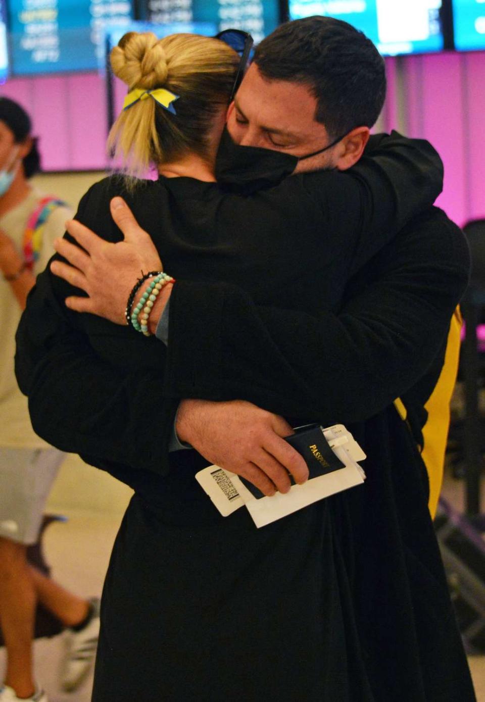 Maksim Chmerkovskiy is greeted by wife Peta Murgatroyd as he Arrives at LAX after escaping from Ukraine Maksim Chmerkovskiy is greeted by wife Peta Murgatroyd as he arrives at LAX after escaping from Ukraine, Los Angeles, California, USA - 02 Mar 2022