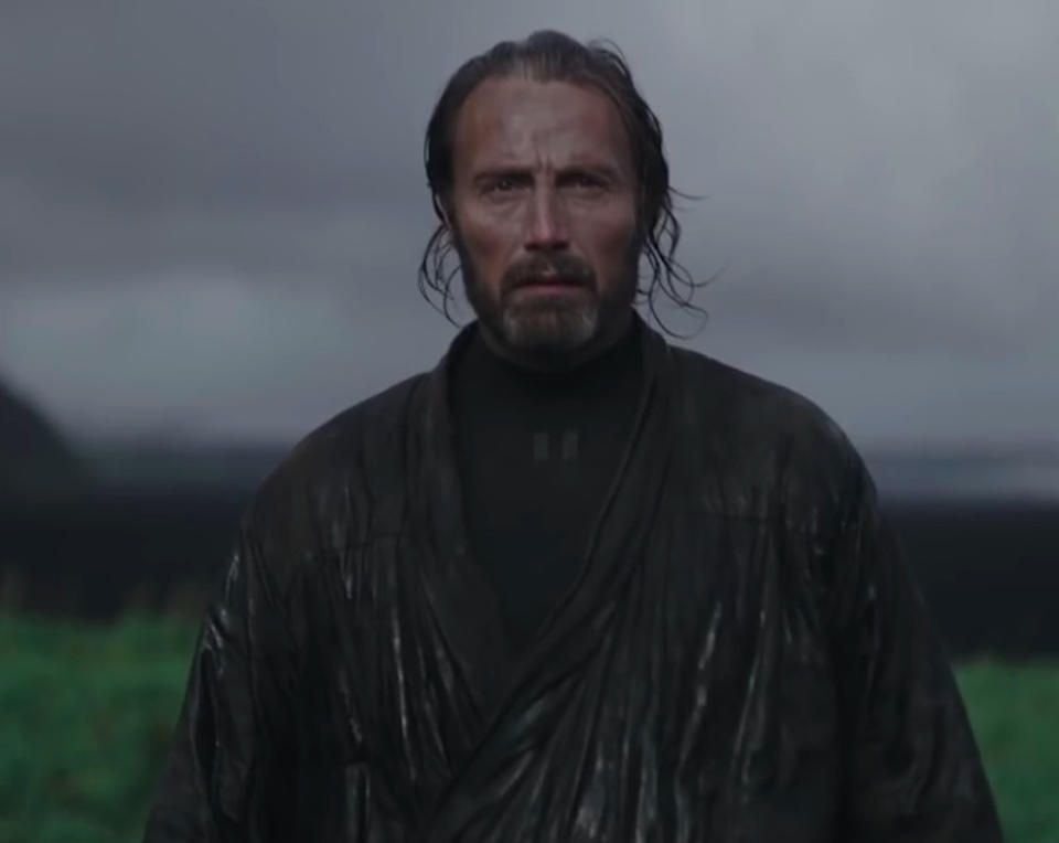 <p>That person is Galen Erso (Mads Mikkelsen), a former school chum of Krennic’s who has become a brilliant scientist specializing in renewable energy with a focus on kyber crystals, the “living” gems that power lightsabers. A pacifist at heart, he reluctantly agrees to help Krennic to protect his little girl, whom he nicknames “Stardust.” (Photo: Lucasfilm) </p>