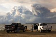 Evacuees watch the wildfire near Fort McMurray, Alberta, on Wednesday, May 4, 2016. Jason Franson/The Canadian Press