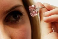 A 24.78 carat Fancy Intense Pink Diamond sold for 45,442,500 CHF (about $47M USD) at auction in October 2010. (Photo by Matthew Lloyd/Getty Images)