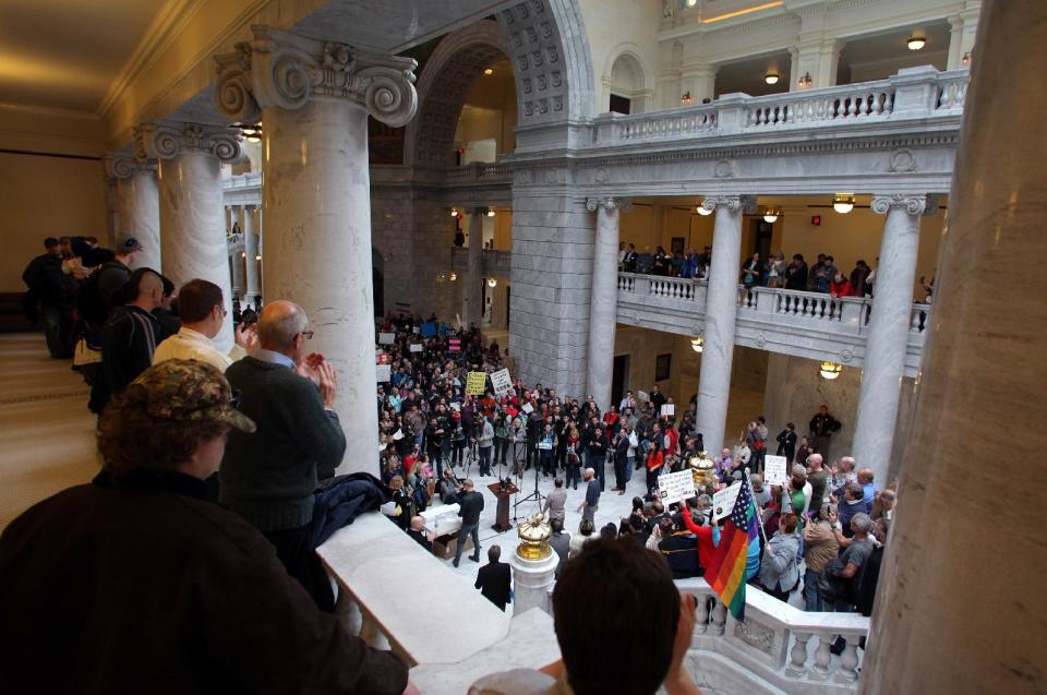 Supporters of gay marriage fill the rotunda as they gather to rally at the Utah State Capitol and deliver over 58,000 petition signatures in support of gay marriage to Utah Governor Gary Herbert January 10, 2014 in Salt Lake City. (Photo/Steve C. Wilson)