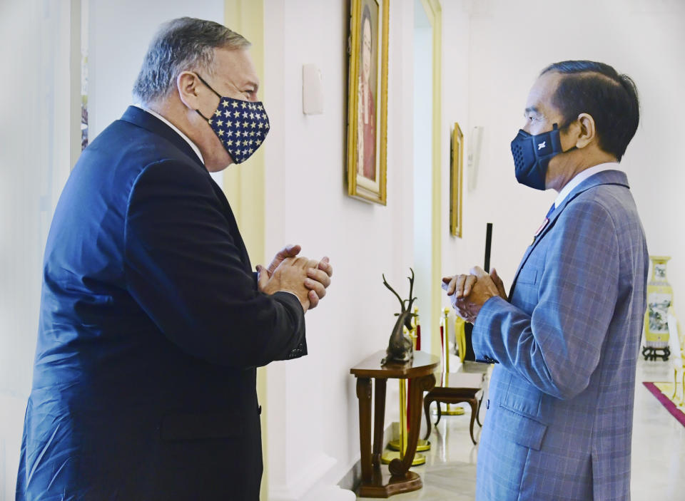 In this photo released by the Indonesian Presidential Palace, Indonesian President Joko Widodo, right, talks with U.S. Secretary of State Mike Pompeo during their meeting at Bogor Presidential Palace in Bogor, West Java, Indonesia, Thursday, Oct. 29, 2020. Pompeo renewed the Trump administration's rhetorical onslaught against China in Indonesia on Thursday as the American presidential election looms. (Indonesian Presidential Palace via AP)