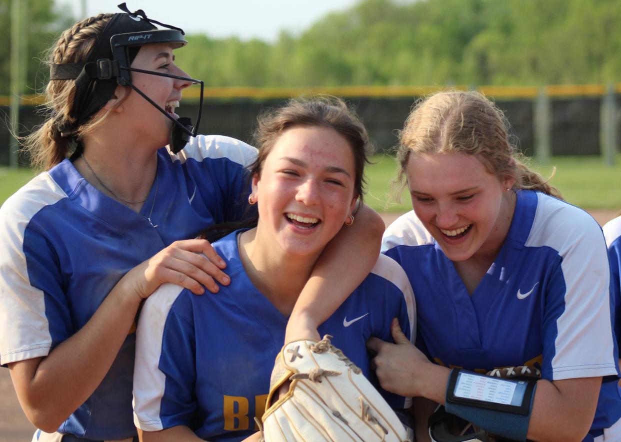 Jefferson pitcher Julia Perry (left) celebrates a 4-1 win over Milan Wednesday with teammates Lindsey Gennoe (center) and Grace Jones.