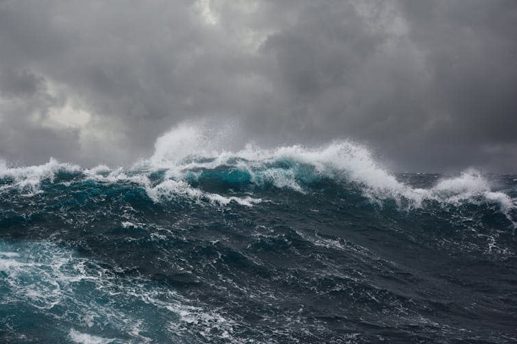 Big ocean wave, stormy sky