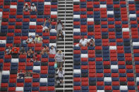 Fans dot the stands prior to a NASCAR Cup Series auto race at Talladega Superspeedway in Talladega Ala., Sunday, June 21, 2020. (AP Photo/John Bazemore)