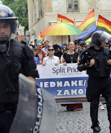 Gay Pride activists wave rainbow flags as they participate in a Gay rights march in the Adriatic port of Split. Hundreds of riot police were on guard Saturday as Croatia's second city hosted a gay parade seen as a test of tolerance in the EU-bound country after violence last year left a dozen people injured