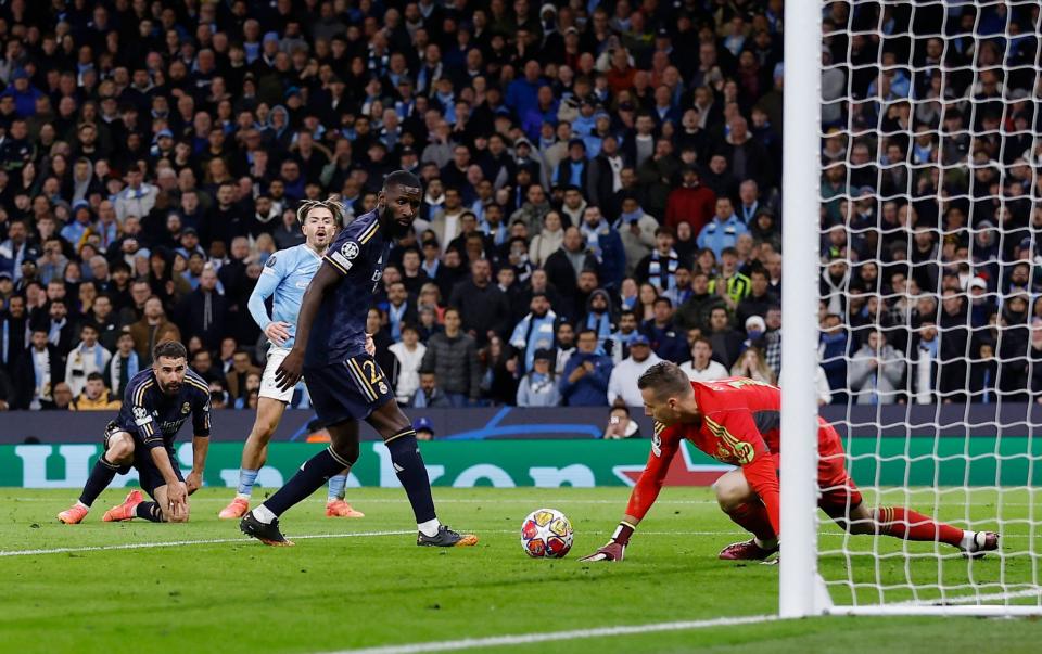 Andriy Lunin saves from a jack Grealish save