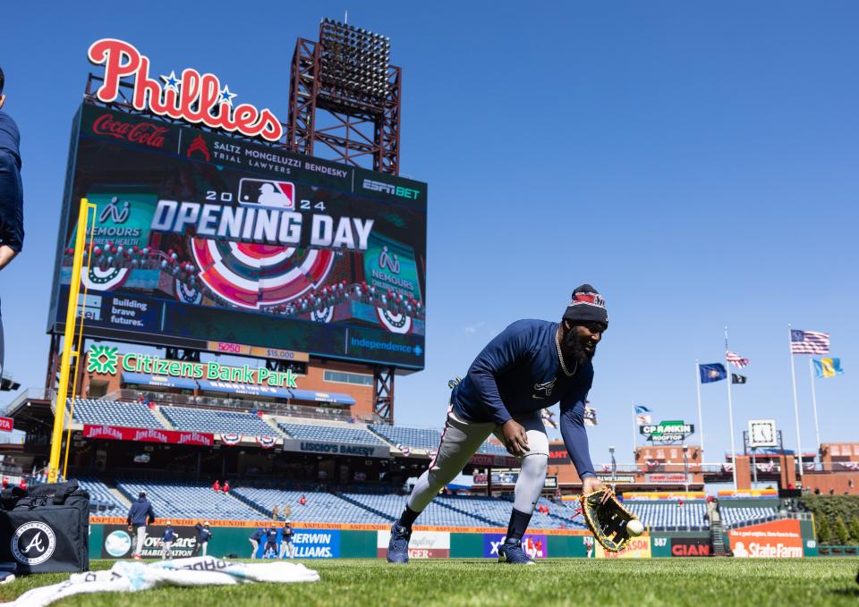 Atlanta Braves' Marcell Ozuna warms up before opening day against the Philadelphia Phillies at Citizens Bank Park in Philadelphia on Friday, March 29, 2024.