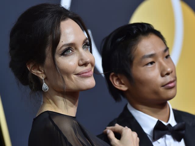 <p>Axelle/Bauer-Griffin/FilmMagic</p> Angelina Jolie and son Pax Thien Jolie-Pitt attend the 75th Annual Golden Globe Awards on January 7, 2018 in Beverly Hills, California.