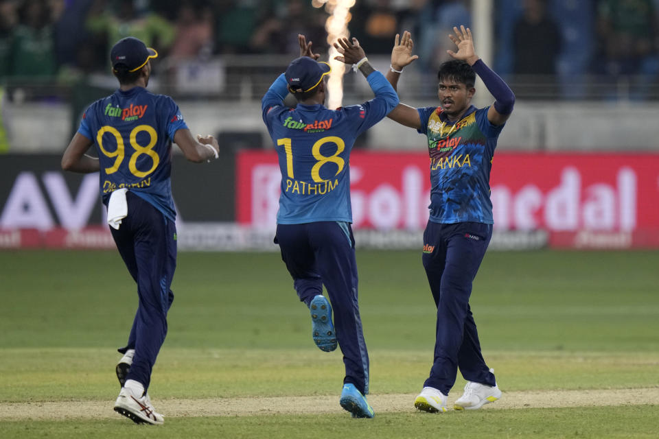 Sri Lanka's Pramod Madhushan, right, celebrates with teammates the dismissal of Pakistan's Iftikhar Ahmed during the T20 cricket Asia Cup final match between Pakistan and Sri Lanka, in Dubai, United Arab Emirates, Sunday, Sept. 11, 2022. (AP Photo/Anjum Naveed)