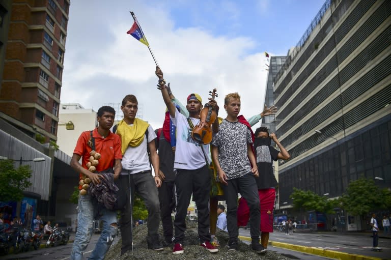 Protesters take to the streets of Caracas as the government vows to go forward with a controversial rewrite of the country's constitution