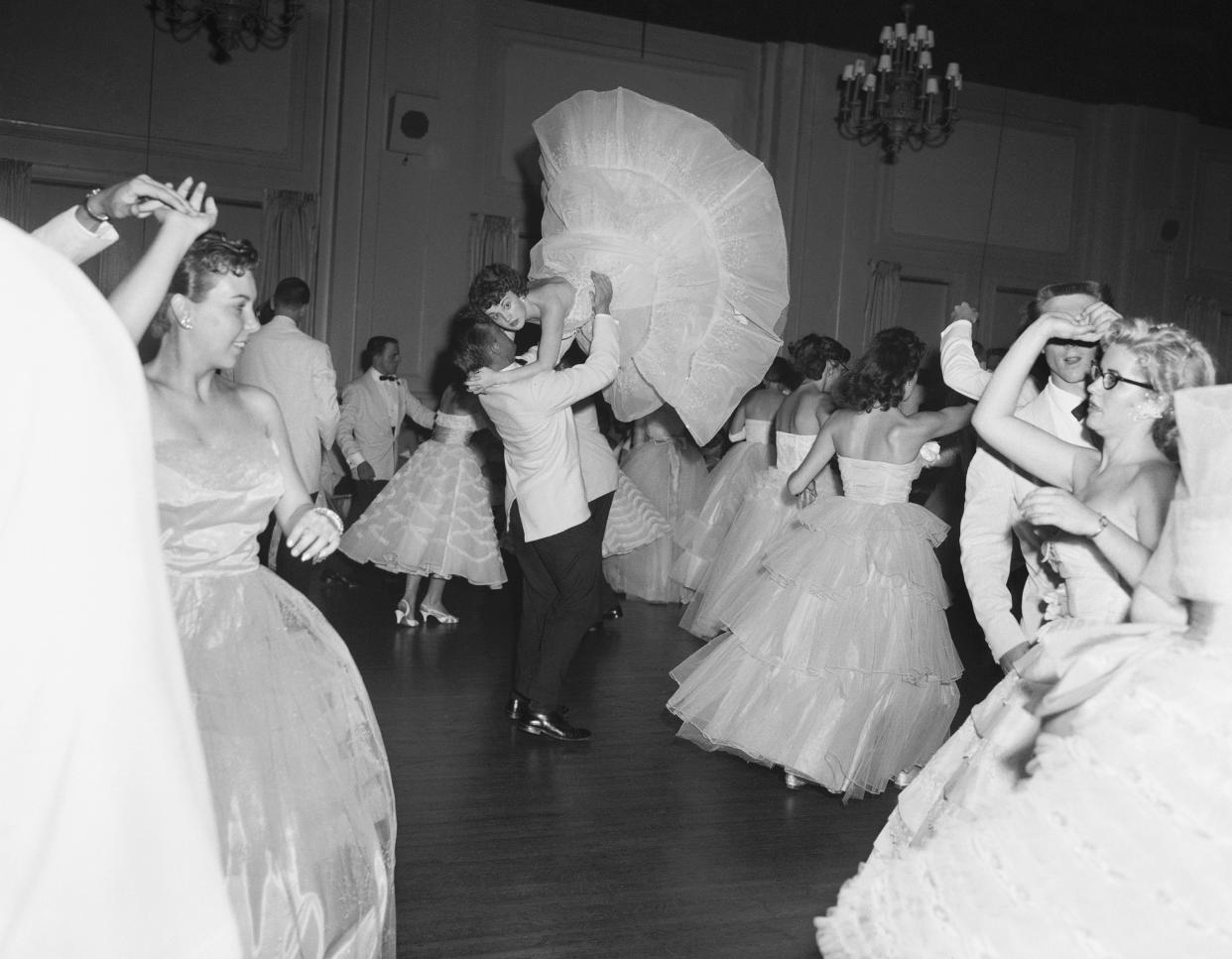 DuPont Manual High School seniors were having their prom and all was dignity and decorum until the orchestra cut loose with a few hot licks and Mary Ray Douglas, 18, and her date Joe Breen started to really to cut the rug at Louisville on June 1, 1957.