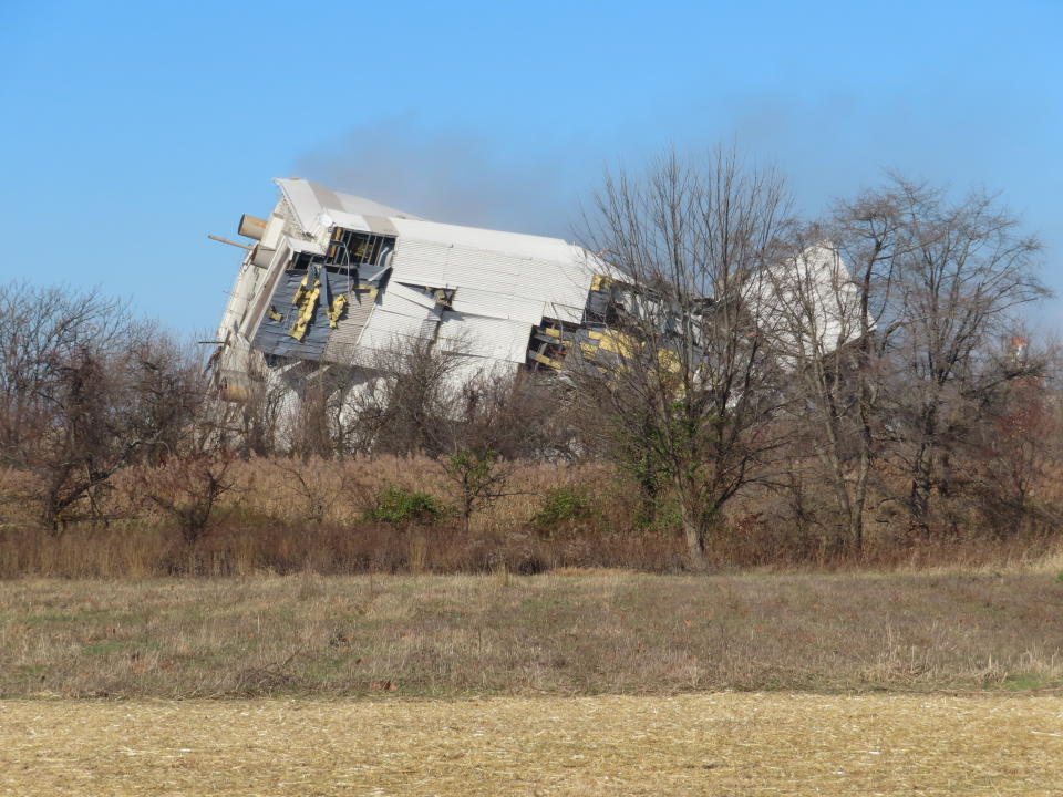 The remains of a former coal-fired power plant in Logan Township, N.J. are seen moments after it was imploded Friday, Dec. 2, 2022, to make way for a battery facility to store energy from clean power sources including wind and solar energy. (AP Photo/Wayne Parry)