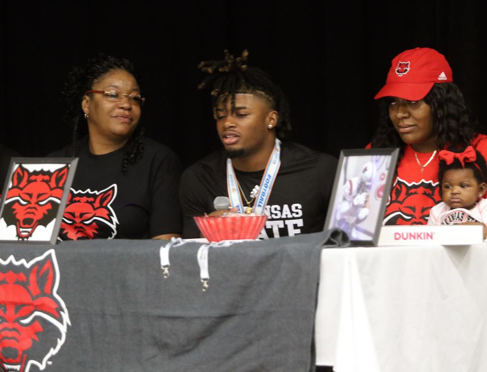 Lake Wales defensive end Terrell speaks to the crowd on Thursday morning in the Lake Wales High School auditorium during a signing ceremony. James signed with Arkansas State.