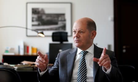 FILE PHOTO: German Finance Minister Olaf Scholz is pictured in his office during an interview with Reuters in Berlin