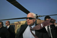 <p>Senator and Republican presidential candidate John McCain, center, is seen arriving for a visit in Sderot, southern Israel, Wednesday, March 19, 2008. Touring the war-battered town, McCain said he understands Israel’s tough response to Palestinian rocket fire, adding that there is no point in negotiating with the Gaza Strip’s Islamic Hamas regime. (Photo: Uriel Sinai, Pool/AP) </p>