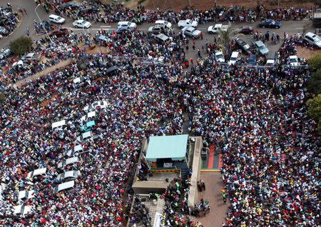 Thousands of supporters of the ruling party Zanu PF gather outside the party headquarters to show support for President Robert Mugabe following a wave of anti-governement protests over the last two weeks in Harare, Zimbabwe July 20, 2016. REUTERS/Philimon Bulawayo