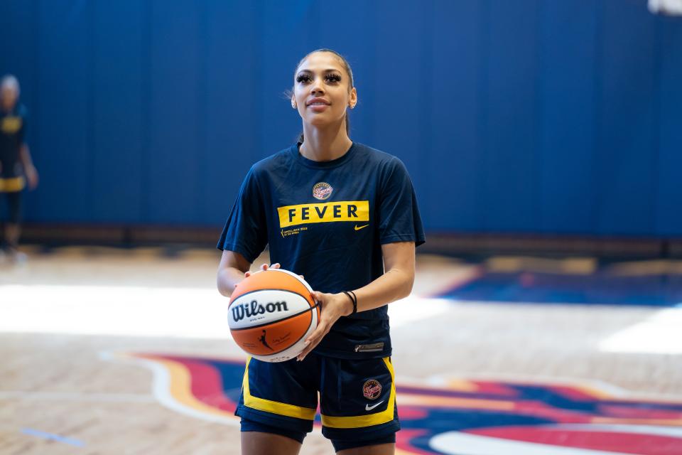 Indiana Fever rookie Kysre Gondrezick sets up to shoot during training camp.