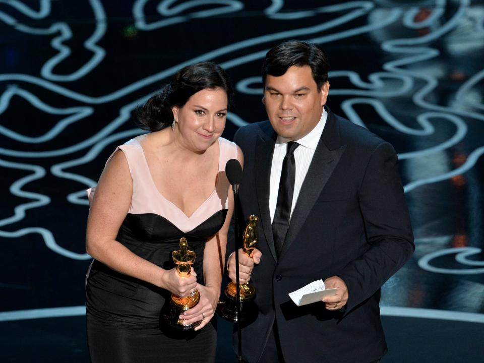 Kristen Anderson-Lopez and Robert Lopez accept the Best Achievement in Music Written for Motion Pictures, Original Song award for 'Let It Go' from 'Frozen' onstage during the Oscars at the Dolby Theatre on March 2, 2014 in Hollywood, California.