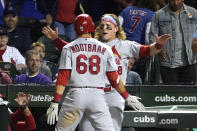 St. Louis Cardinals' Lars Nootbaar (68) celebrates his home run off Chicago Cubs relief pitcher Adam Morgan with Harrison Bader during the seventh inning of a baseball game Friday, Sept. 24, 2021, in Chicago. (AP Photo/Charles Rex Arbogast)