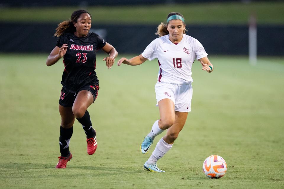 Florida State Seminole Maria Alagoa (18) moves the ball down the field. The Florida State Seminoles defeated the Louisville Cardinals 5-1 Thursday, Sept. 22, 2022. 