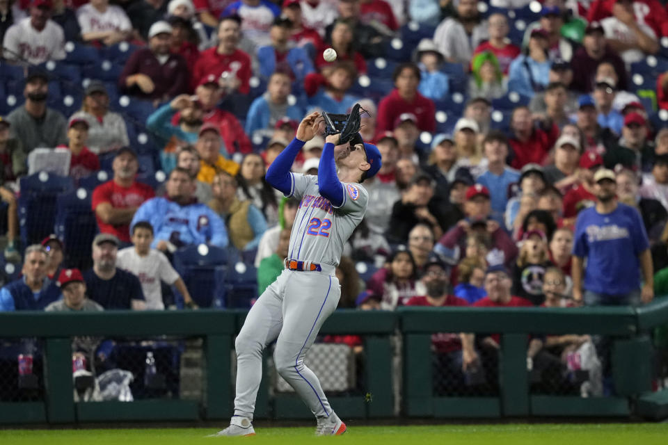 New York Mets third baseman Brett Baty catches a fly out by Philadelphia Phillies' Kyle Schwarber during the third inning of a baseball game, Sunday, Sept. 24, 2023, in Philadelphia. (AP Photo/Matt Slocum)