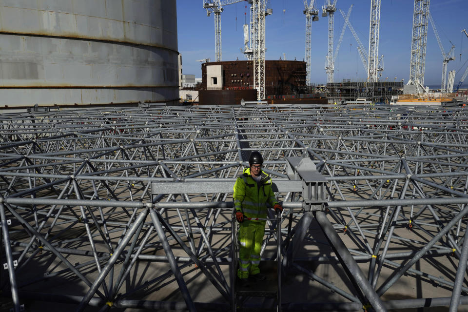 A worker works at the construction site of Hinkley Point C nuclear power station in Somerset, England, Tuesday, Oct. 11, 2022. Sites like the Hinkley Point C nuclear power plant have become integral to the U.K. government’s “net zero” by 2050 strategy. (AP Photo/Kin Cheung)