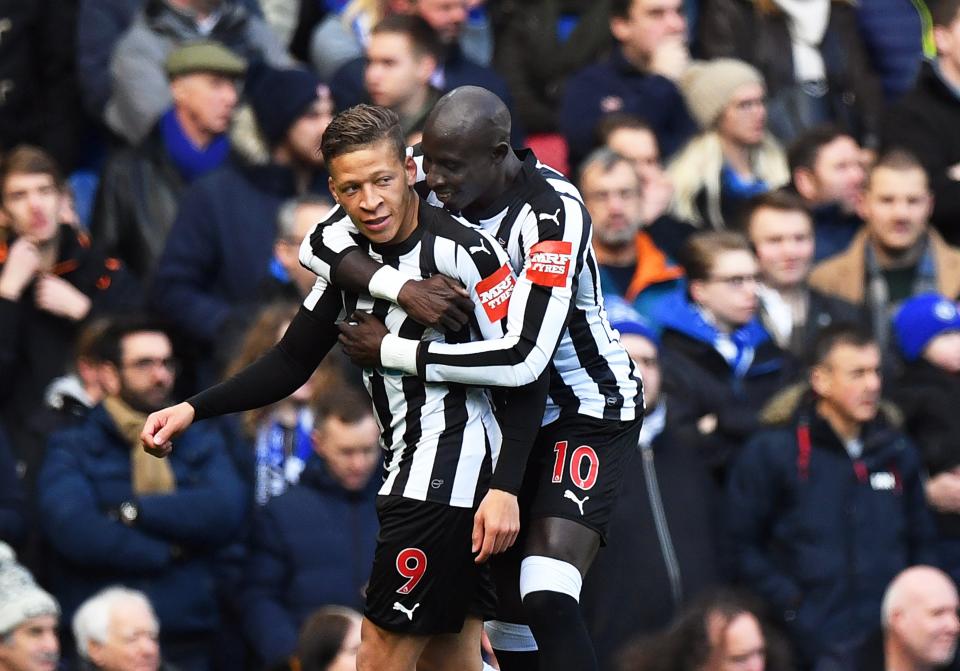 Newcastle’s Dwight Gayle (L) celebrates with his teammate Mohamed Diame (R) after scoring the opening goal against Chelsea.