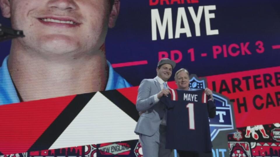 North Carolina quarterback Drake Maye poses with NFL commissioner Roger Goodell after being chosen by the New England Patriots with the third overall pick during the first round of the NFL football draft, Thursday, April 25, 2024, in Detroit.