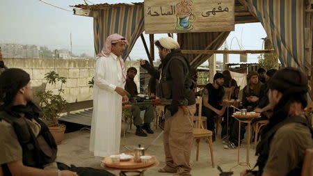 Saudi actor Nasser al-Qasabi (in white) plays the role of an Islamic State fighter in the new Saudi TV show "Selfie", a sketch comedy show which debuted last week on Saudi-owned pan-Arab satellite channel MBC, in this undated handout photo provided by MBC. REUTERS/MBC/Handout via Reuters