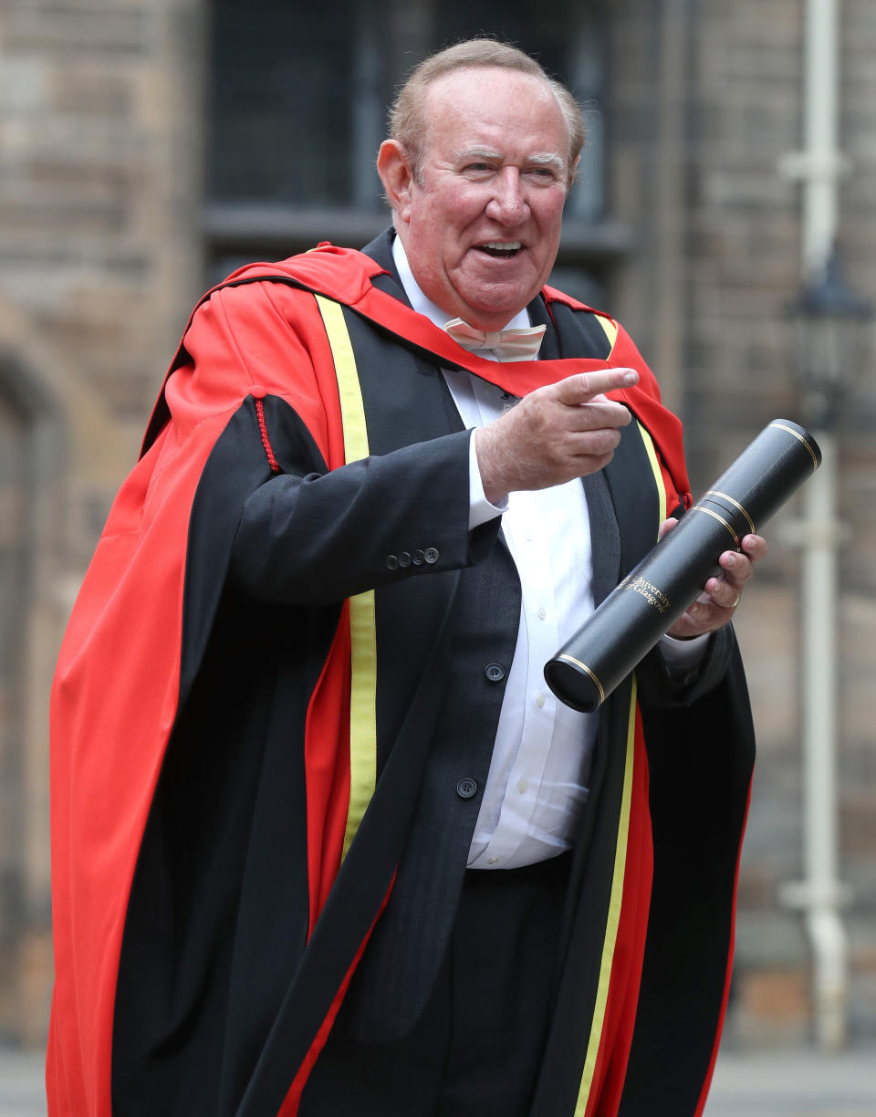 Broadcast and journalist Andrew Neil with his honorary degree in the East Quadrangle at Glasgow University after receiving it in a ceremony.