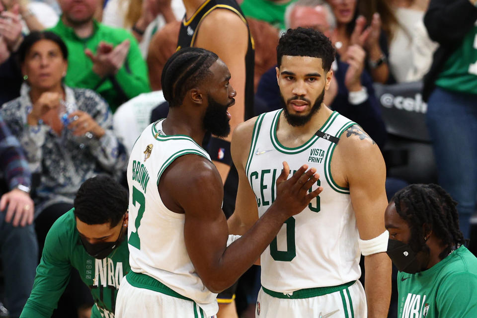 Jaylen Brown and Jayson Tatum of the Boston Celtics talk over a play during Game 4 of the 2022 NBA Finals on June 10. (Elsa/Getty Images)