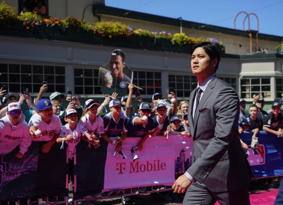 American League's Shohei Ohtani, of the Los Angeles Angels, walks during the All-Star Game red carpet show, Tuesday, July 11, 2023, in Seattle. (AP Photo/Lindsey Wasson)