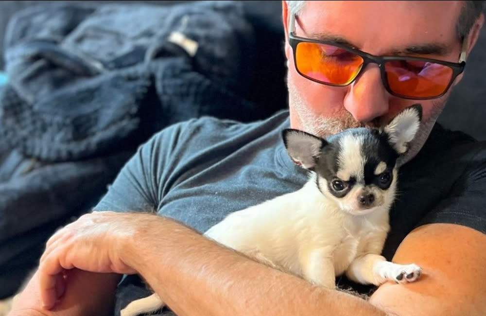 Simon Cowell has another new puppy credit:Bang Showbiz