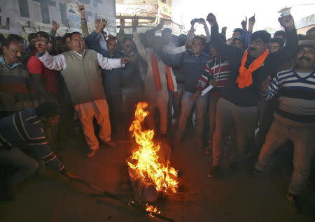 Supporters of Shiv Sena, a Hindu hardline group, shout slogans as they burn an effigy depicting Pakistan's Prime Minister Nawaz Sharif during a protest near the Indian Air Force (IAF) base at Pathankot in Punjab, January 3, 2016. REUTERS/Mukesh Gupta
