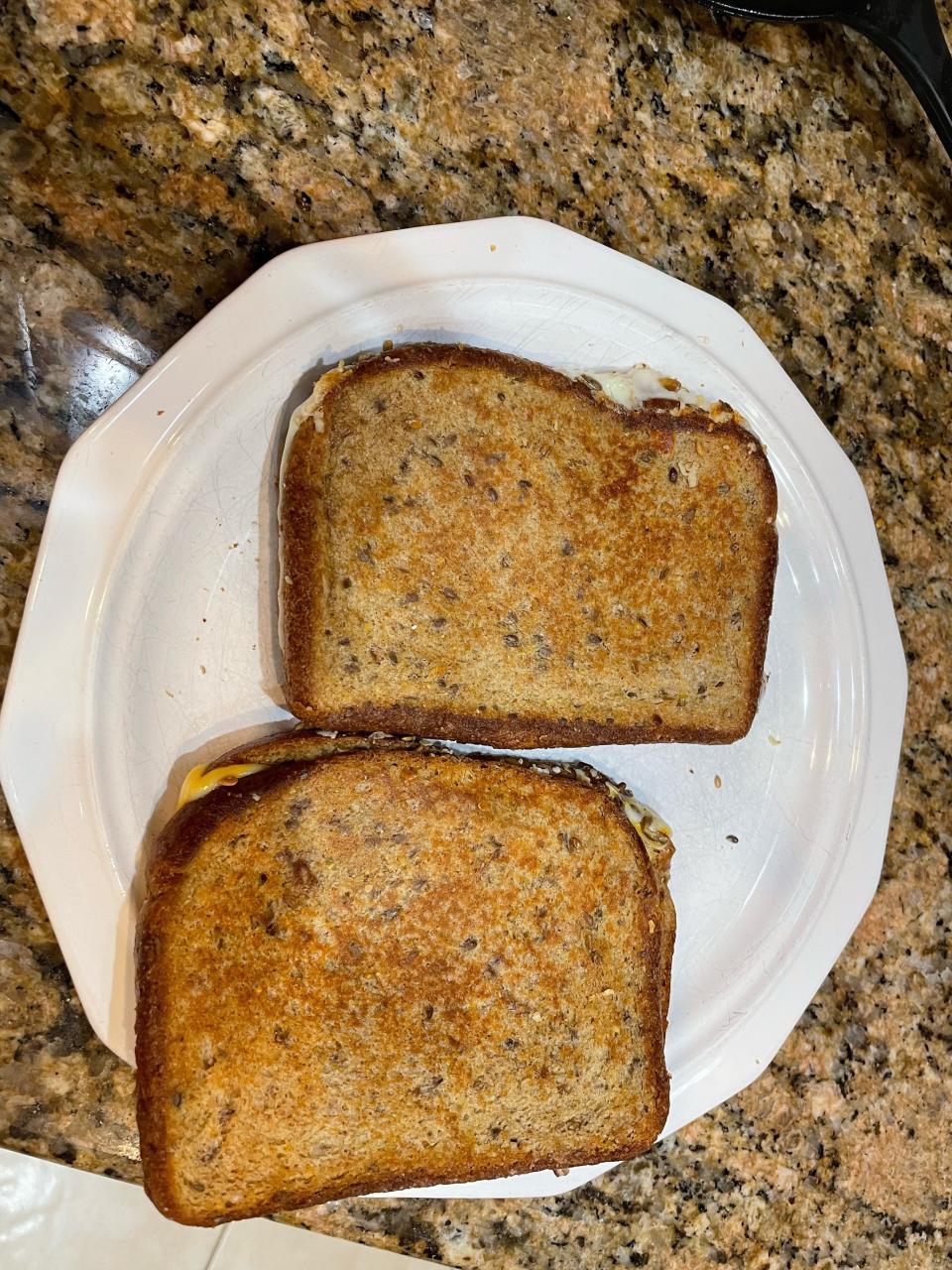 A 54-year-old Fayetteville pharmacist eats cheese sandwiches at home.