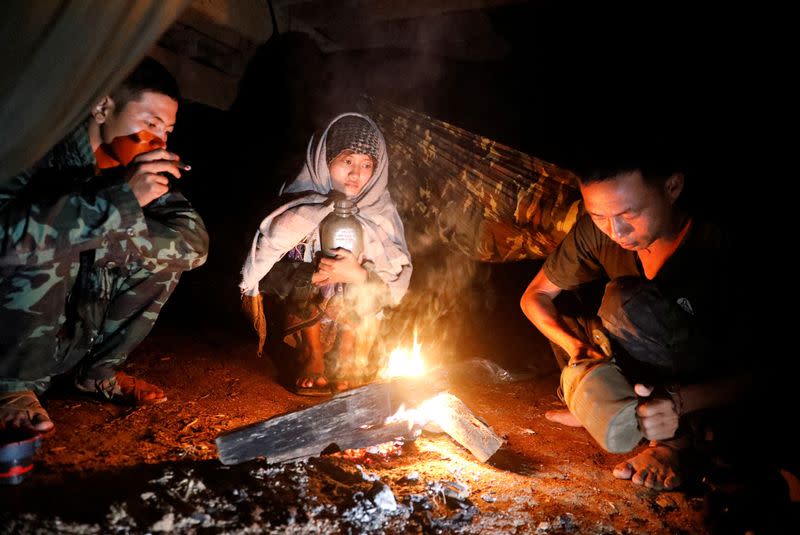 The Wider Image: In Myanmar jungle, civilians prepare to battle military rulers