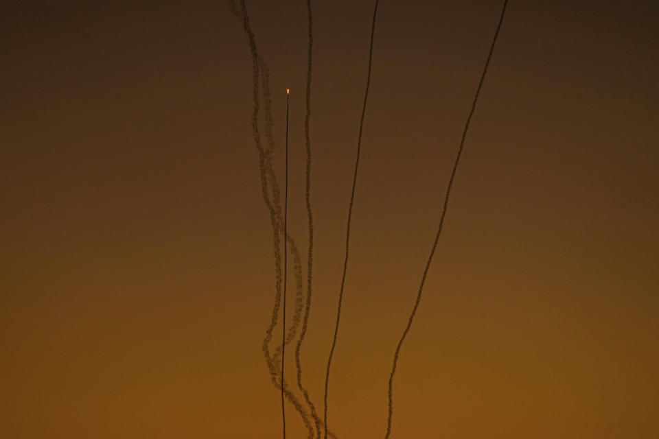 Rockets are fired toward Israel from the Gaza Strip, as seen from southern Israel, Friday, Dec. 15, 2023. (AP Photo/Ariel Schalit)