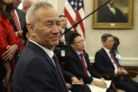 Chinese Vice Premier Liu He listens during a meeting in the Oval Office of the White House with President Donald Trump in Washington, Friday, Oct. 11, 2019. (AP Photo/Andrew Harnik)