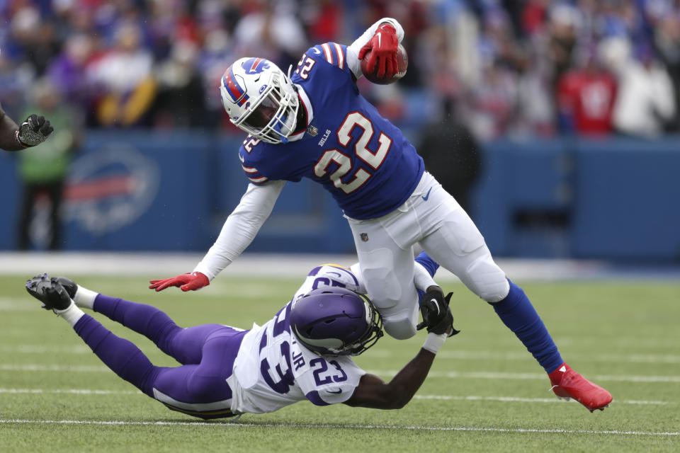 Buffalo Bills running back Duke Johnson (22) is brought down by Minnesota Vikings cornerback Andrew Booth Jr. (23) in the first half of an NFL football game, Sunday, Nov. 13, 2022, in Orchard Park, N.Y. (AP Photo/Joshua Bessex)