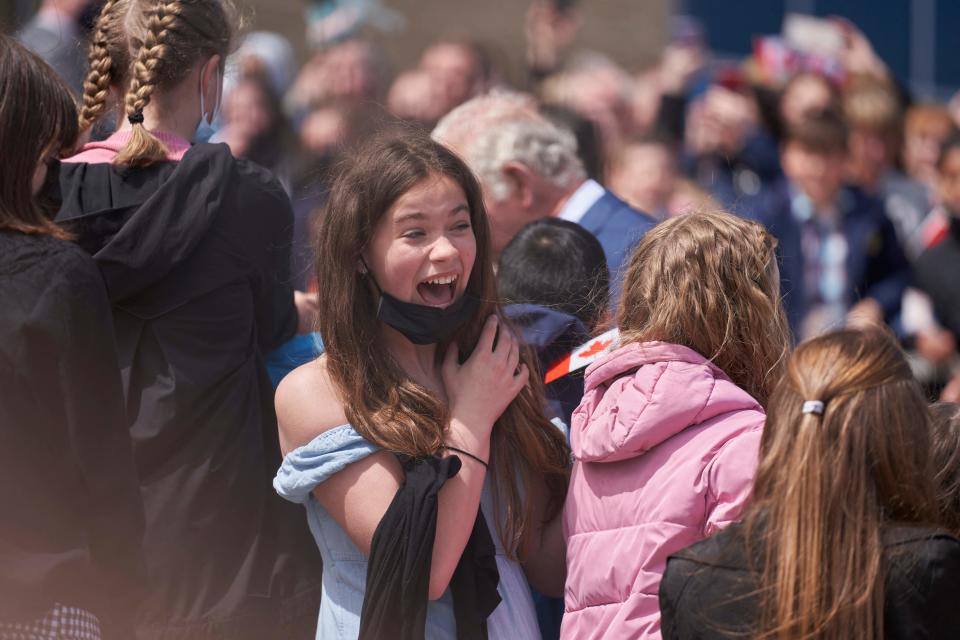 <p>A spectator reacts as Britain's Prince Charles, Prince of Wales, arrives at the Confederation Building in St. John's, Newfoundland and Labrador on May 17, 2022. (Photo by Geoff Robins / AFP)</p> 