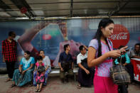 People wait at Sule bus stop in central Yangon, Myanmar, July 25, 2016. Picture taken July 25, 2016. REUTERS/Soe Zeya Tun