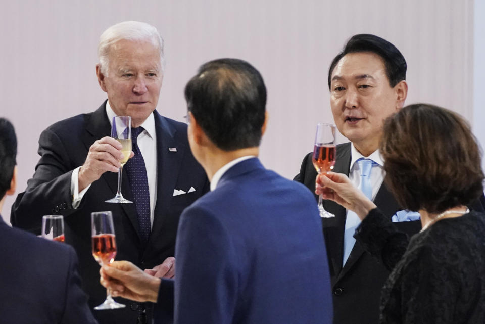 FILE - U.S. President Joe Biden, left, prepares for a toast with South Korean President Yoon Suk Yeol, second right, at a state dinner at the National Museum of Korea, Saturday, May 21, 2022, in Seoul. Leaked U.S. intelligence documents suggesting that Washington spied on South Korea have put the country’s president in a delicate situation ahead of a state visit to the U.S. (AP Photo/Evan Vucci, File)
