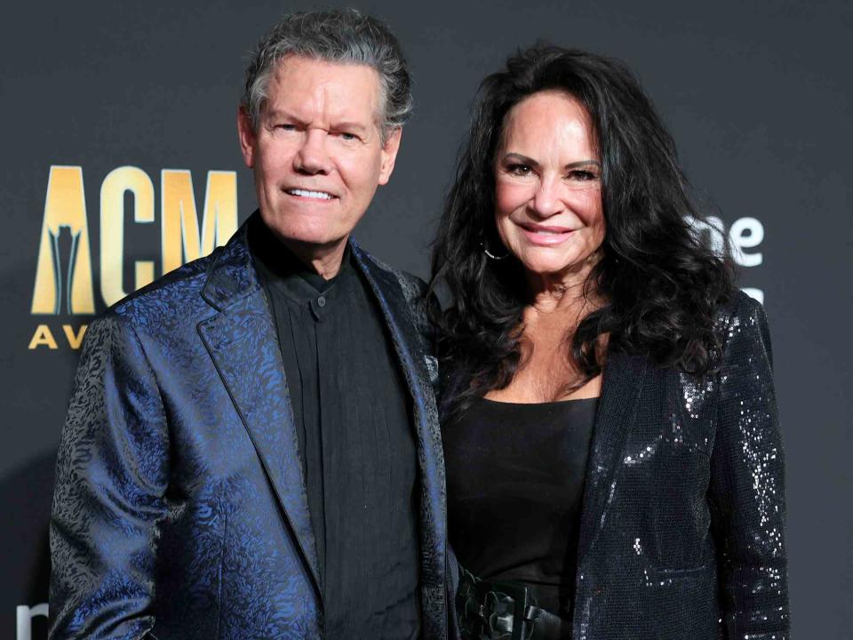 <p>Theo Wargo/WireImage</p> Randy Travis and Mary Davis attend the 58th Academy Of Country Music Awards on May 11, 2023 in Frisco, Texas.