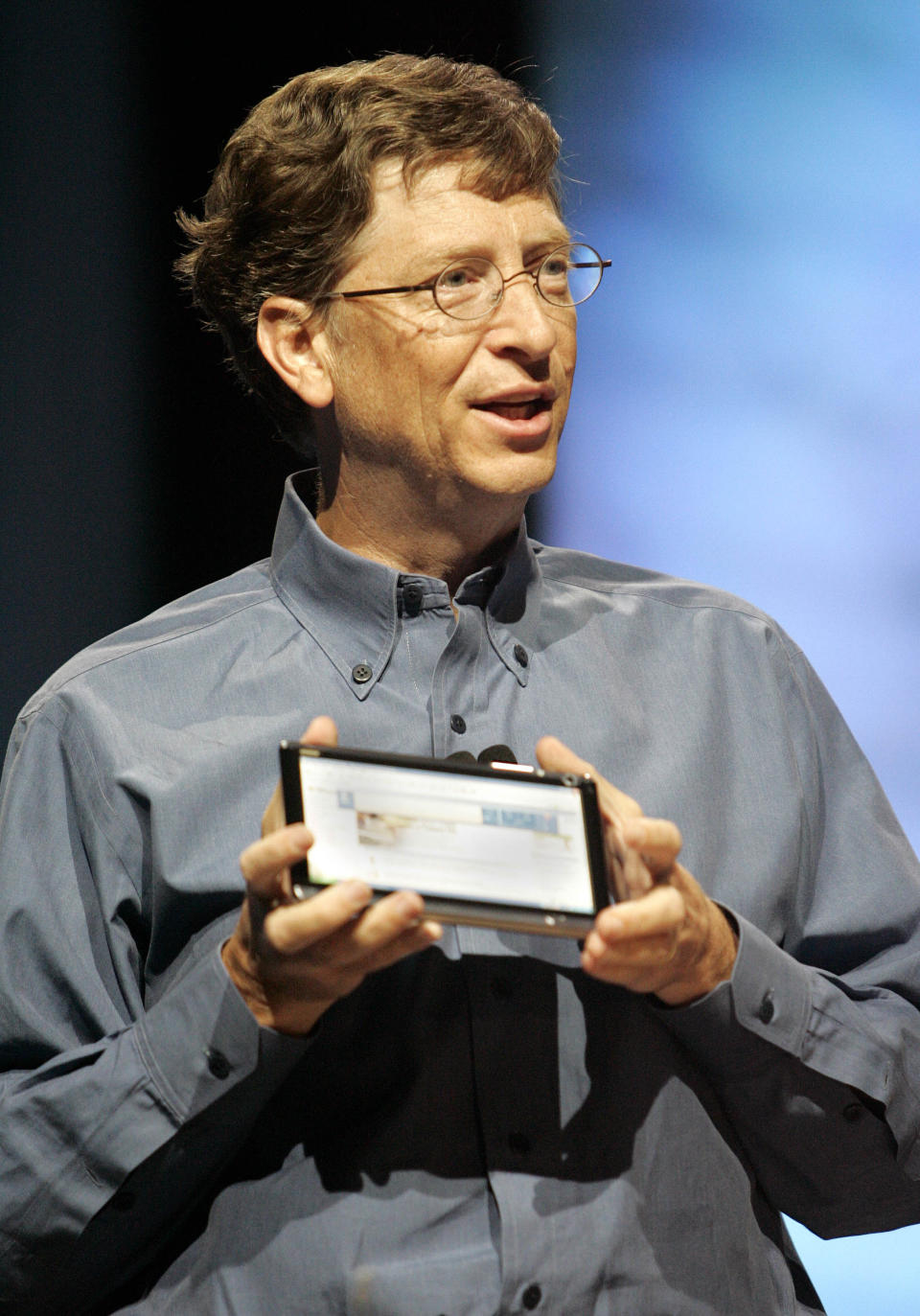 FILE- In an April 25, 2005, file photo provided by Microsoft, then Microsoft Chairman and Chief Software Architect Bill Gates shares a prototype of an "ultra-mobile" Tablet PC during a keynote speech for attendees at the Microsoft Windows Hardware Engineering Conference in Seattle. For decades, the tablet computer was like a mirage in the technology industry: a great idea, seemingly reachable on the horizon, that disappointed as hopeful companies got closer." (AP Photo/Microsoft, Robert Sorbo, File)