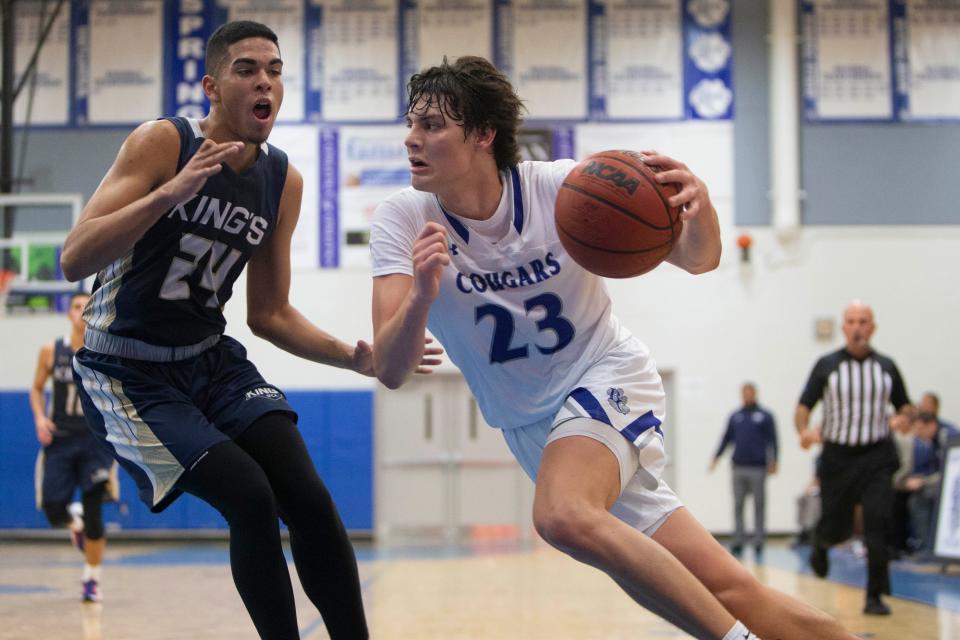 Barron Collier's Anthony Cancelleri (23) drives against Southwest Florida Christian Academy's Wil Gonzalez (24) during the second half of the varsity boys basketball game between SFCA and Barron Collier, Tuesday, Nov. 30, 2021, at Barron Collier High School in Naples, Fla.Barron Collier defeated SFCA 82-77 in overtime.